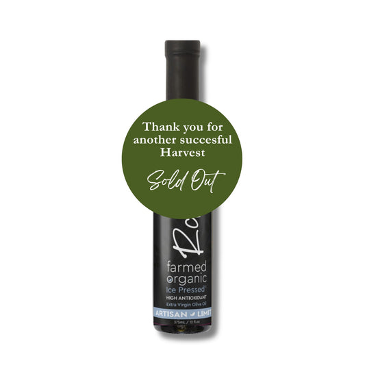 Bottle of olive oil with a green label on a white background
